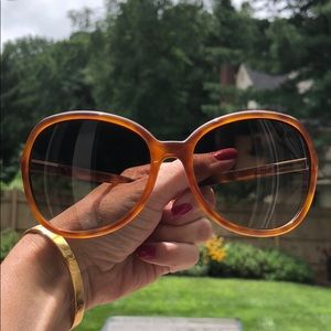 PRADA tortoise glasses.